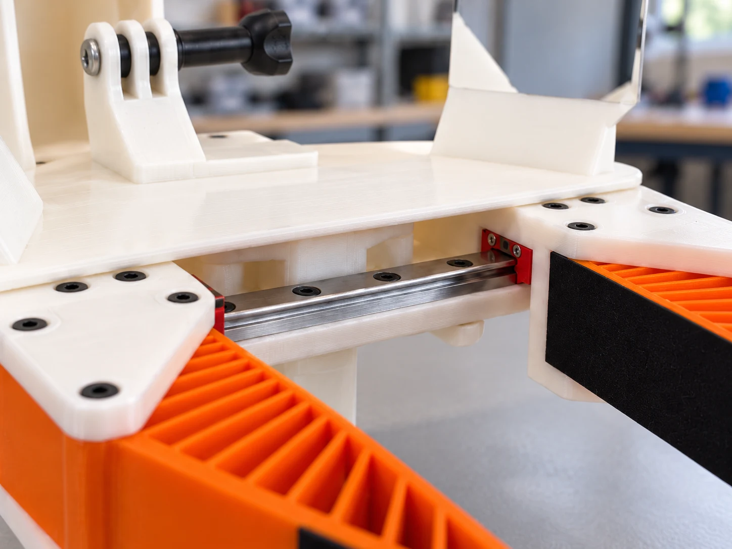 Metal linear rail beneath the white printed chassis